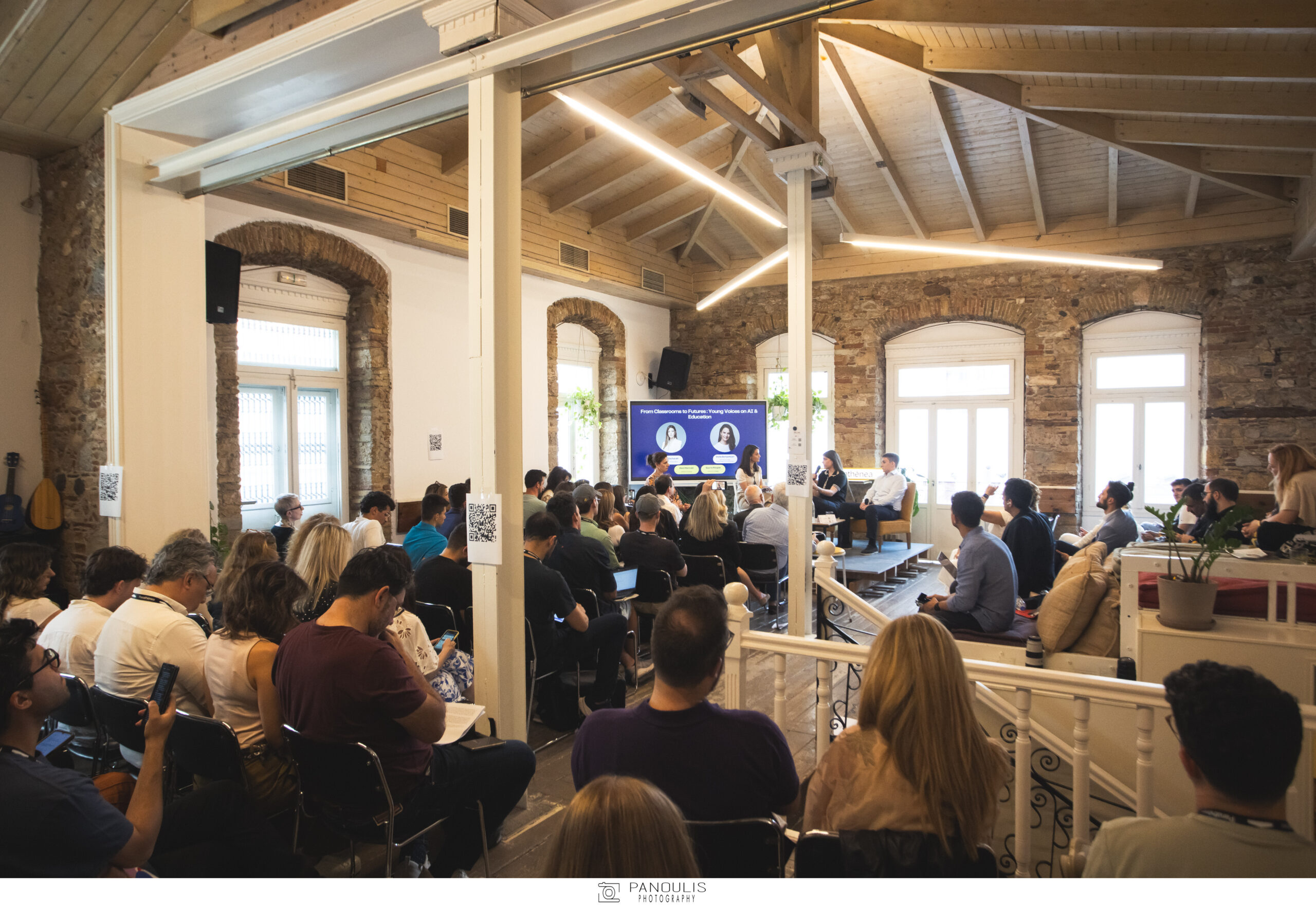 Audience and panel at an education event